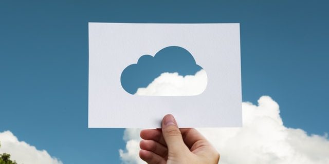 Paper cutout of a cloud representing Cloudflare